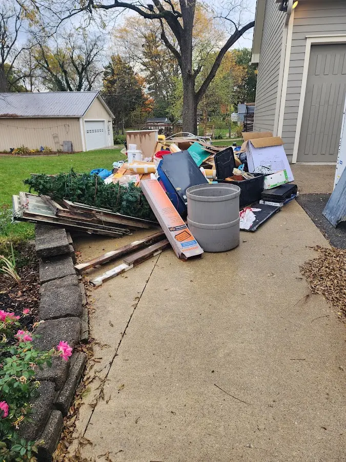 Dumpster being loaded with debris for Estate Cleanout Dumpster Rental in Cotati